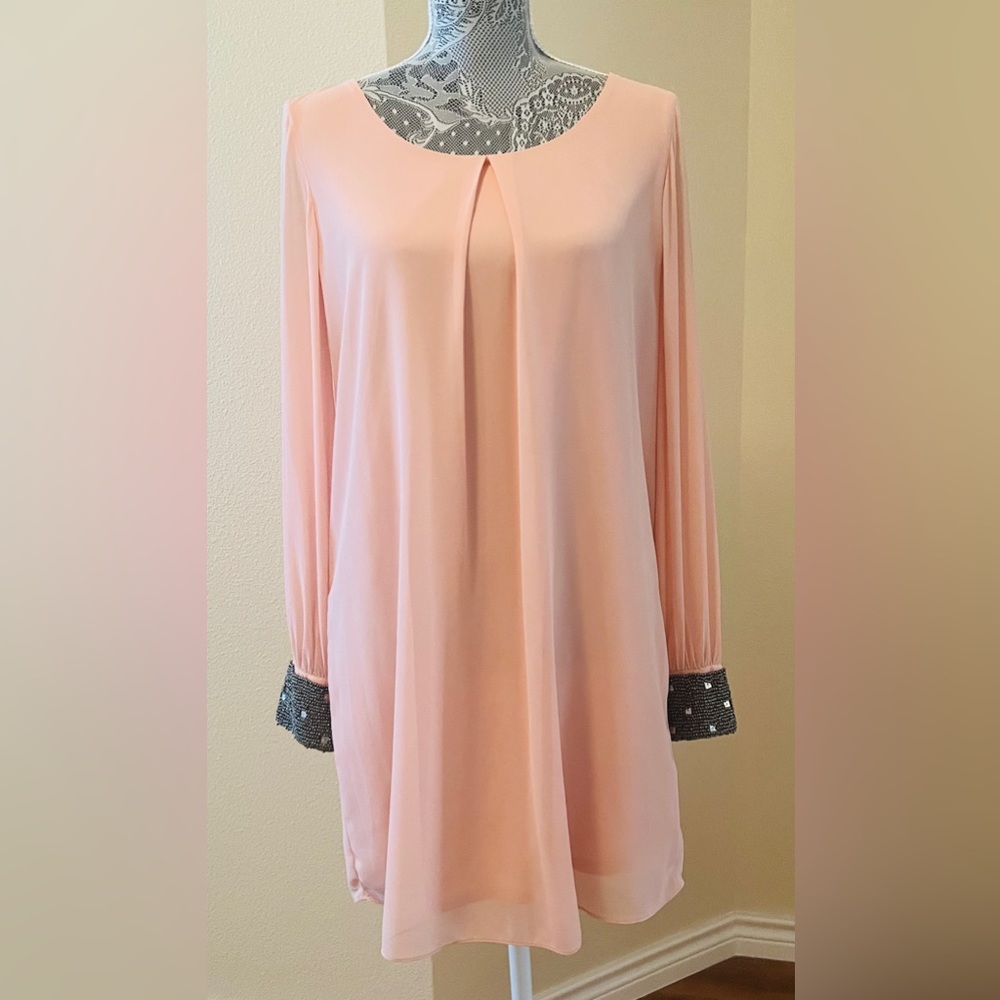 Peach dress. , beautiful beaded cuffs.